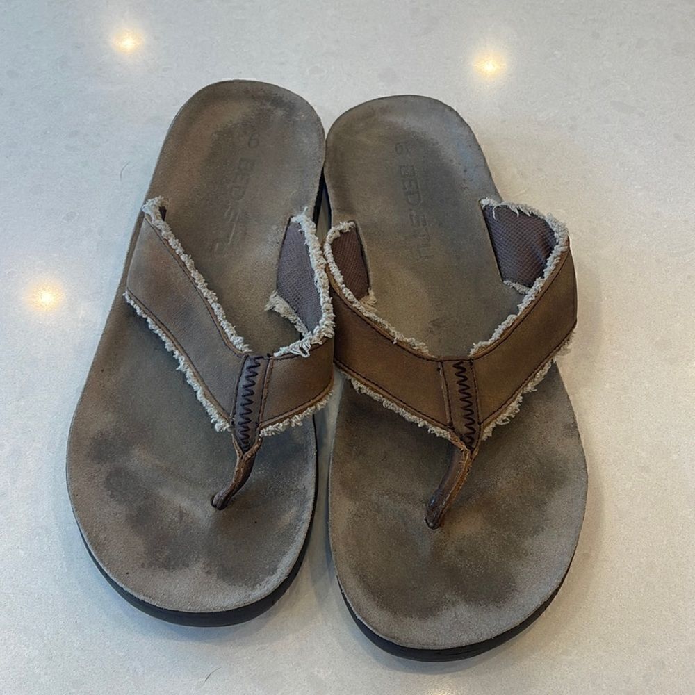 Bed Stu mens flip flops size 9 right size 10 left might work for you See picture